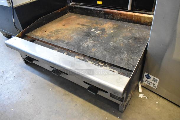 Radiance stainless steel commercial countertop natural gas flat top griddle, used condition, visible signs of wear.