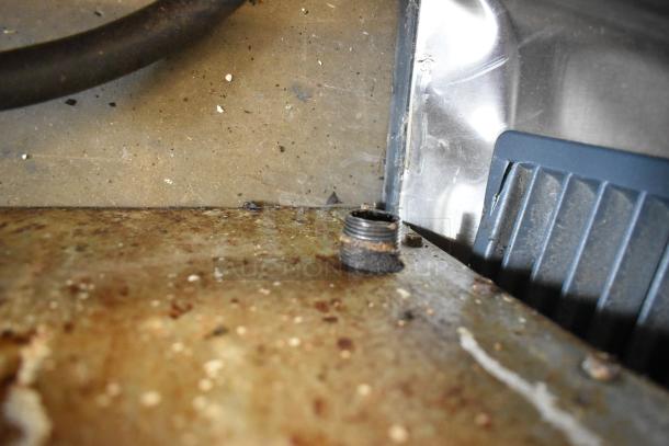 Radiance stainless steel commercial countertop natural gas flat top griddle, showing close-up of connection area and surface detail.