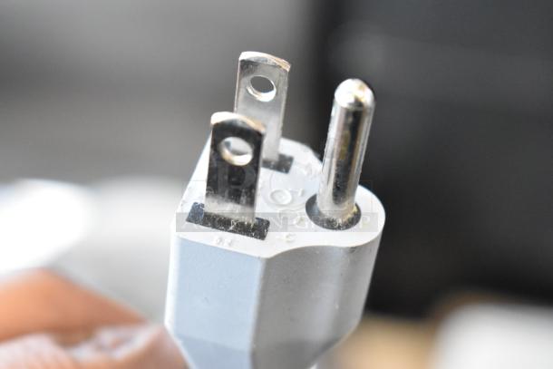 Close-up of a three-prong electrical plug for the 2018 Bizerba GSP H commercial meat slicer, 120 volts, 1 phase.