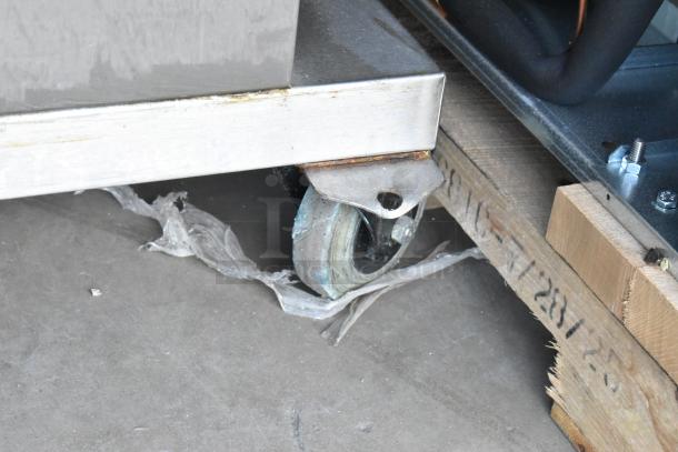 Fri-jado TDR7-P rotisserie oven on caster, stainless steel, electric powered, 208V, 3-phase, visible casters and base.