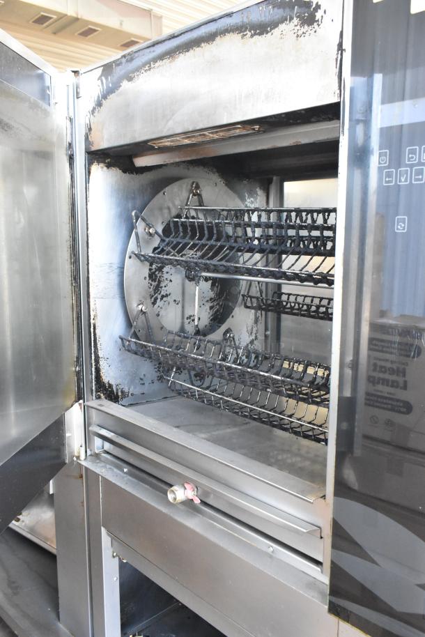 Fri-jado TDR7-P stainless steel rotisserie oven, electric, 208V, 3-phase, on commercial casters, used condition.