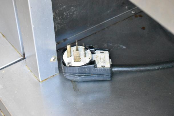 Fri-jado TDR7-P rotisserie oven plug with a 208-volt, 3-phase connection on stainless steel base. Commercial-grade.