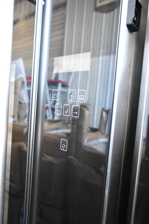 Fri-jado TDR7-P stainless steel electric rotisserie oven with touch controls, 208V, 3 phase, on casters.