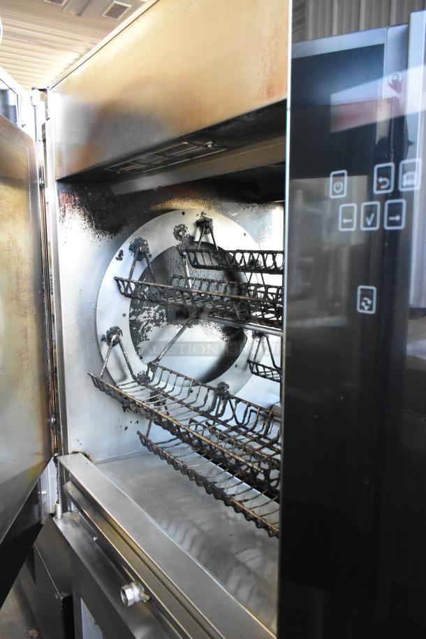 Fri-jado TDR7-P stainless steel rotisserie oven, electric, commercial casters, visible control panel, slightly used condition.