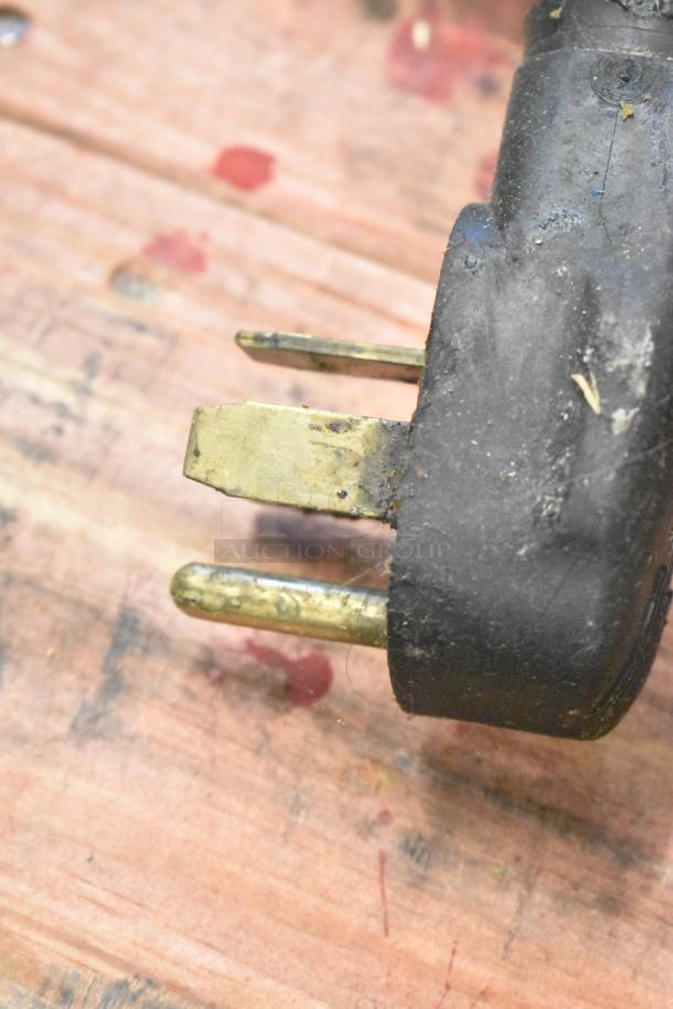 Close-up of power plug for Fri-jado TDR 7 P rotisserie oven, slightly worn. 208V, 3-phase.