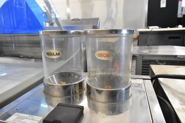 Stainless steel MF Bistro espresso machine with steam wand, two labeled hoppers for regular and decaf, 208/240 volts, 1 phase.