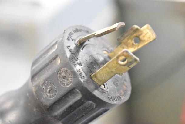 Close-up of a power plug for a commercial espresso machine, marked for 208/240 volts, 1 phase, 30A, made in USA.