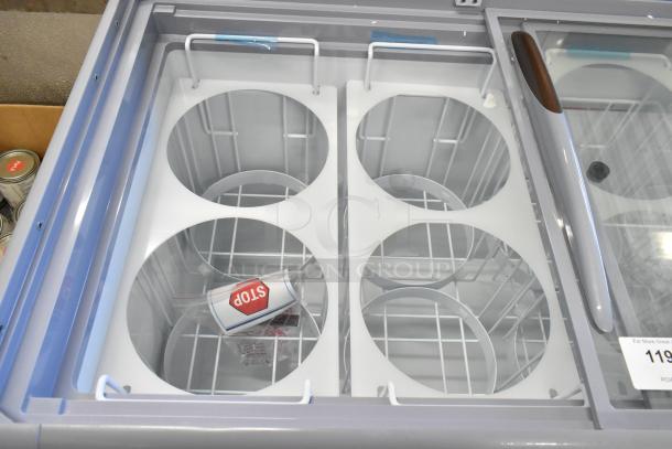 BRAND NEW KoolMore KM-ICD-49SD ice cream dipping cabinet, 8 tub capacity, sliding glass door, visible "STOP" tag, metal construction.