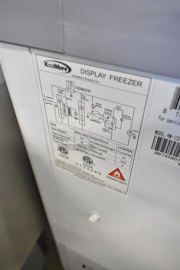 KoolMore KM-ICD-49SD ice cream dipping cabinet label, showing model, voltage, and design pressure details.