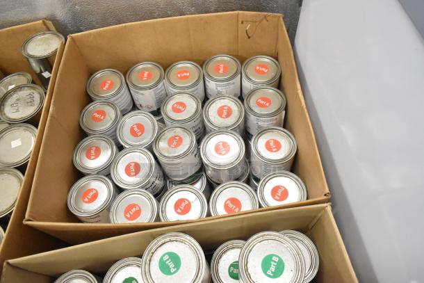 Boxes containing various Pro Guard chemicals, including Proflex Primer 1501 Part A and Part B. Labels visible.