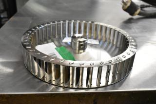 BRAND NEW Garland US Range G02952-01P Blower Wheel Assembly, plated, minor scratches, visible labels, high-quality construction.