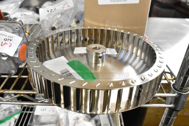 Brand new Garland G02952-01P blower wheel assembly, metal plated, slight dents, visible model tag and barcode sticker.
