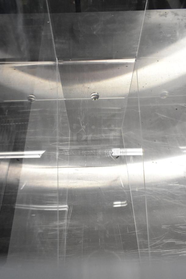 4 scratch-and-dent items, including Choice black 2-section cup and lid organizer and clear poly dry ingredient dispenser.