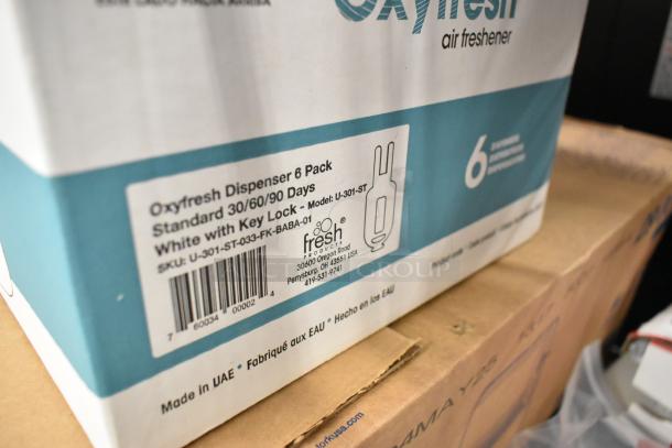 Fresh Products Oxyfresh white air freshener system, 6-pack. Model: U-301-ST. New in box with key lock feature.