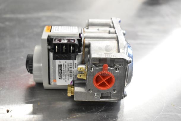 Brand new Honeywell gas valve VR8204A2837. Minor scratches and dents visible. Label indicates model and specifications.