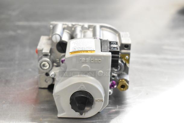 Alt text: Resideo VR8204A2837 gas valve, scratch and dent, new condition, visible warning label, control knob, and connectors.