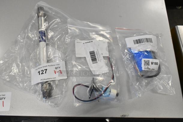 Three brand new items in bags: Giles 40956 hose, Estella 348PSMRCAP56 capacitor, and Hoshizaki 435490-01 float switch.