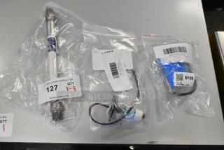 Three brand new items in bags: Giles 40956 hose, Estella 348PSMRCAP56 capacitor, and Hoshizaki 435490-01 float switch.
