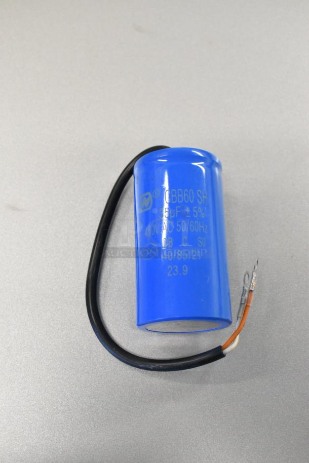 Blue CBB60 SH capacitor, 35μF ±5%, 450VAC 50/60Hz, with wires attached, on grey background.