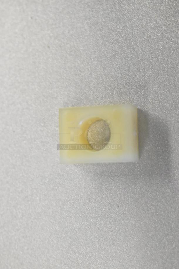 Rectangular plastic component with central hole, part of an 8-piece scratch and dent auction lot.