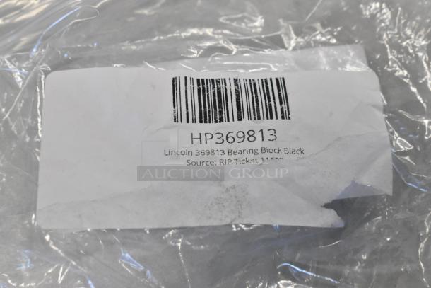 Lincoln 369813 Bearing Block in package with visible label, barcode, and product information. New condition.