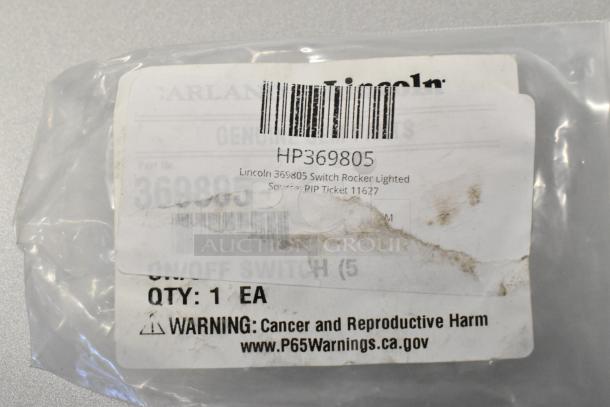Lincoln 369805 Switch Rocker Lighted, part HP369805, in original packaging with label and warning for cancer and reproductive harm.