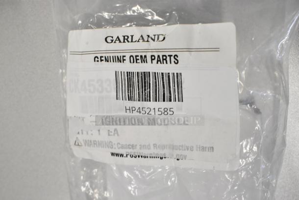 Brand new Garland US Range parts, including oven door spring, ignition module, and Southbend spring. Marked HP4521585.