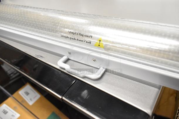 Brand new Avantco 19386567 night curtain for VAC-46W/VAC-46B. Minor scratches visible, handle and caution label shown.