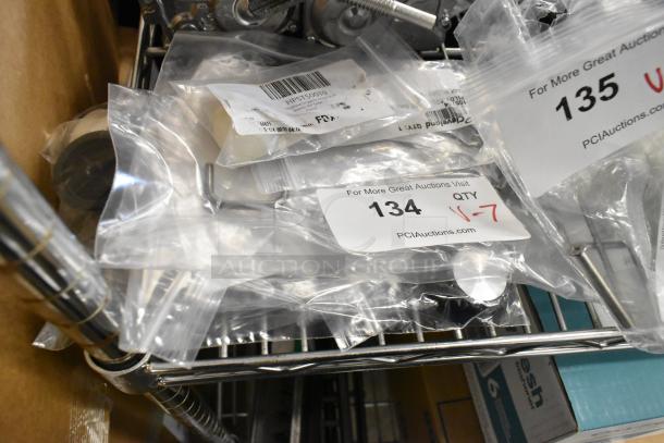 Seven new scratch and dent items, including ServIt control knobs, Southbend pilot tube, and Cleveland components in bags.