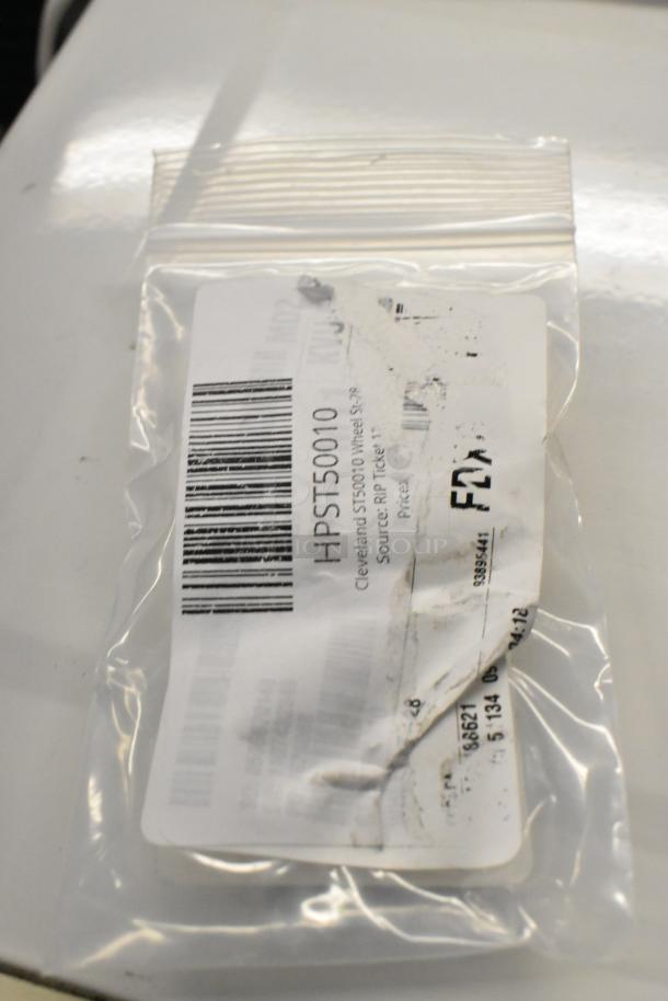 Bag with Cleveland ST50010 Wheel St-28, barcode visible, part of a scratch and dent auction lot.