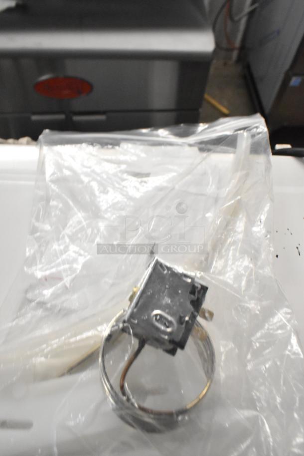 Brand new Hoshizaki SP-5676 Kms thermostat with bulb holder kit, model HPTB0031, in original packaging.