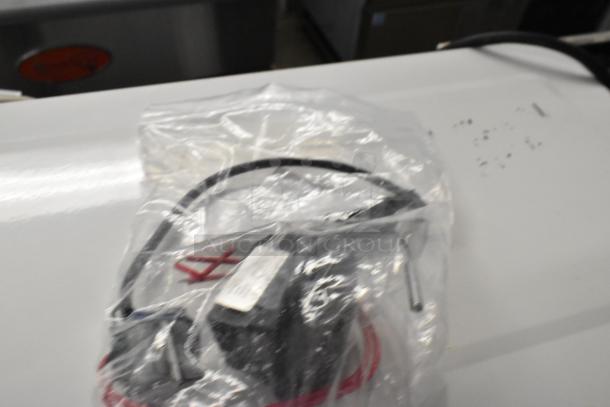 Bag of mixed new scratch and dent kitchen appliance parts, including thermocouples and probes. Sealed package.