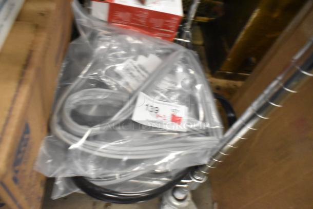 Three brand new Moffat and Hoshizaki gaskets in sealed packaging, with visible product labels and auction tag.