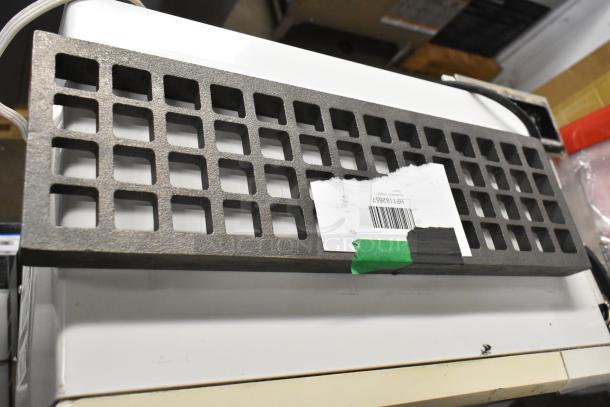 Set of 3 new Southbend parts: Cast Radiant HP1182755, Grate HP1182657, Grate HP1178976; labeled and displayed.