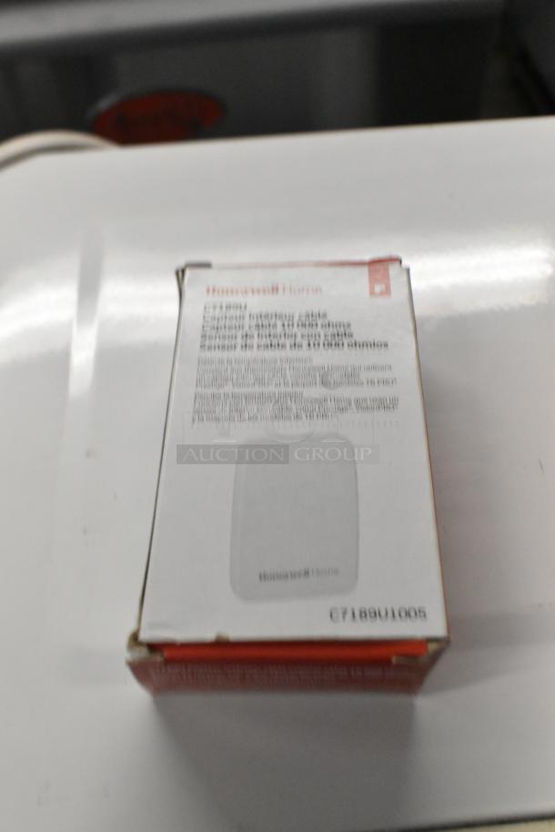 Boxed Honeywell Home Wired Indoor Temperature Sensor, model 92B7189U1005, new condition, visible labeling.