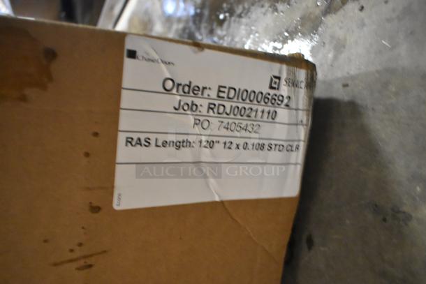 Cardboard box with visible label showing order EDI0006692, 120" plastic strips, job RDJ0021110, PO 7405432.