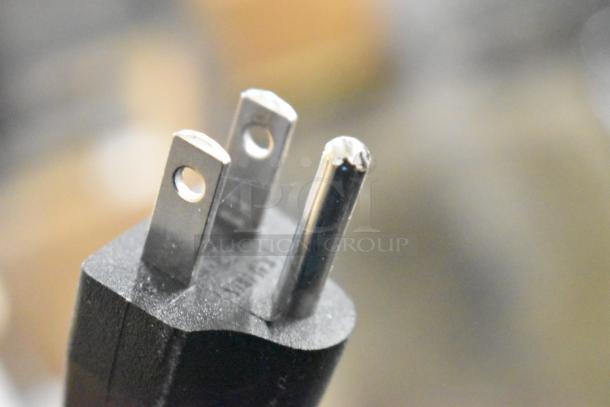 Close-up of a three-pronged plug for the Galaxy 177RWGB90 rice warmer, 120 volts, scratch and dent condition.