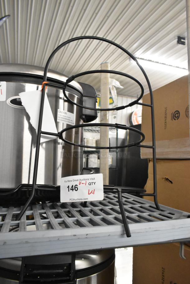 Brand new Cal-Mil 977-10-13 black wire three-tier bowl display, 11.75"x11.75"x20", minor dents, auction tag visible.