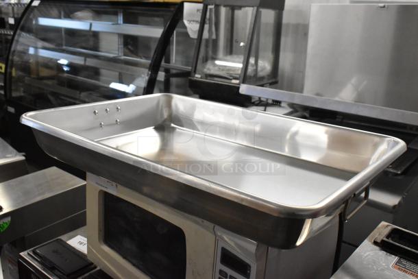 Brand new Choice aluminum baking and roasting pan, 13 Qt., with handles, dimensions 26" x 18" x 3 1/2". Scratch and dent condition.
