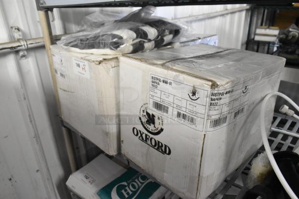 5 brand new items including a 7.5' black and white stripe umbrella canopy and Oxford super blend navy napkins. Boxes show light wear.