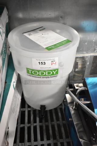 Brand new, scratch and dent Toddy® 975CMLTCM 5 Gallon Commercial Cold Brew System with lift, labeled "153."