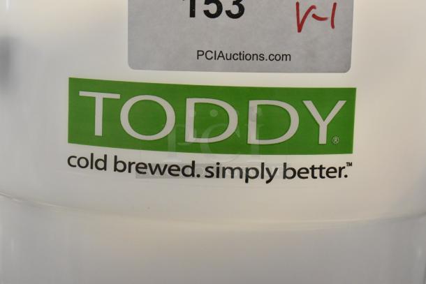 BRAND NEW Toddy® 975CMLTCM 5 Gallon Cold Brew System, commercial use, minor scratches, logo visible.