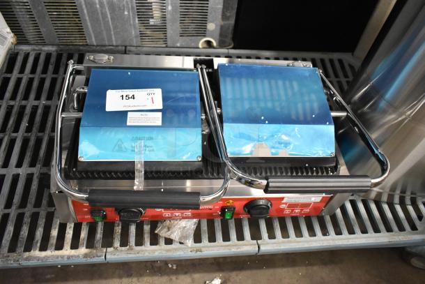 Brand new Avantco 177PG400T commercial dual panini grill with timer, grooved plates, 19 5/8" x 9 1/8" surface.