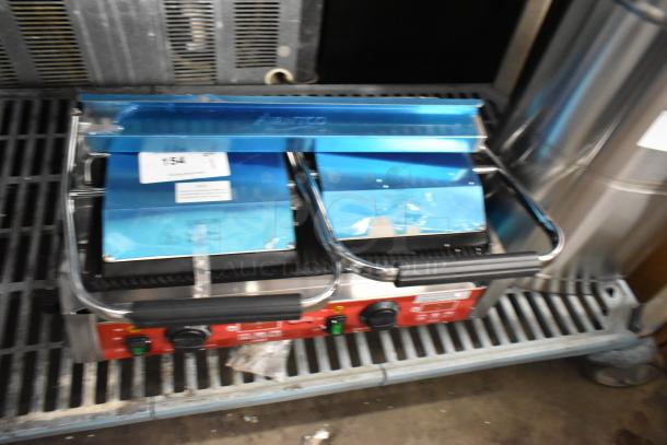 Brand new Avantco 177PG400T commercial dual panini grill with grooved plates, timer, and 19 5/8" x 9 1/8" surface.