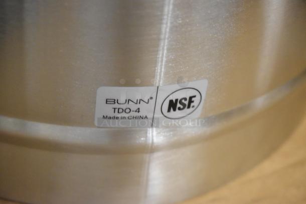 Brand new Bunn TDO-4 4-gallon iced tea dispenser, stainless steel, brew-through lid, slight scratch and dent, NSF certified.