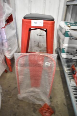 Red metal bar stool with black cushion and backrest, brand new, marked "15x Your Bid". Scratch and dent condition.