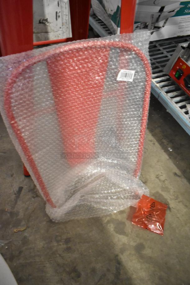Red metal bar stool backrest, bubble-wrapped, slight scratches visible. Includes box label with manufacturing details.