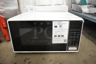 Countertop Microwave Oven MS8436127995-03, 120V, with plate, clear control panel, digital display, features cooking presets.