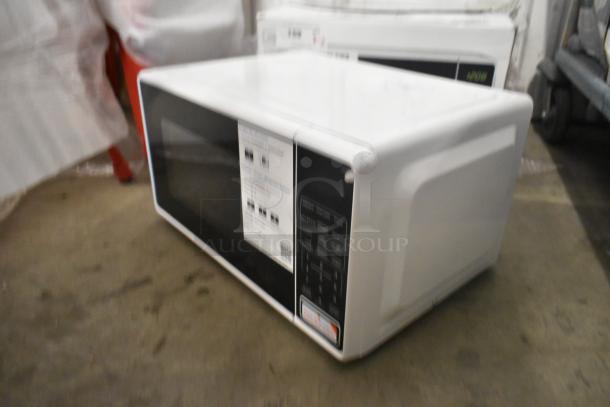 White countertop microwave oven, model MS8436127995-03, with control panel and label instructions. Includes plate, 120 volts, 1 phase.