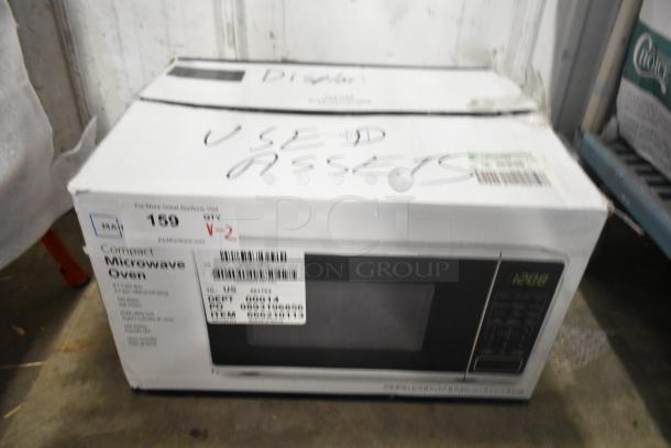 Box containing 2 countertop microwave ovens, model MS8436127995-03. Includes plate, 120 volts, 1 phase. Marked as used assets.